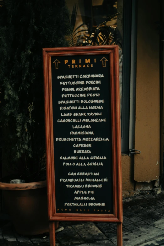 a menu sign for an italian restaurant