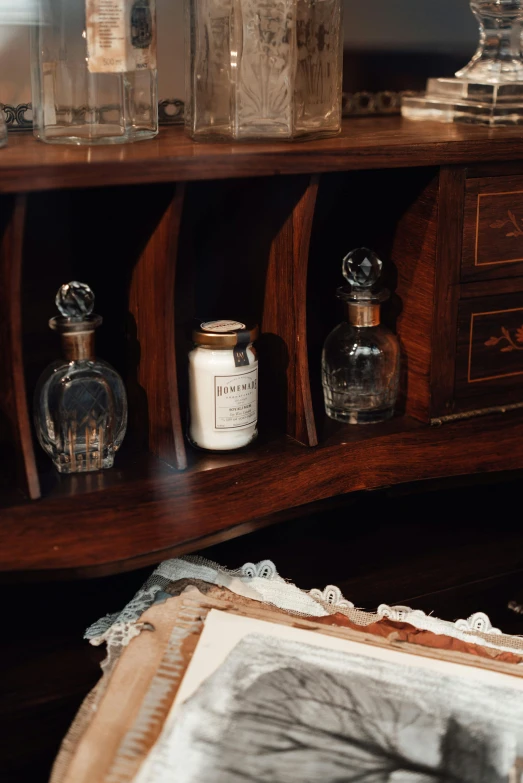 a shelf filled with bottles of antique items