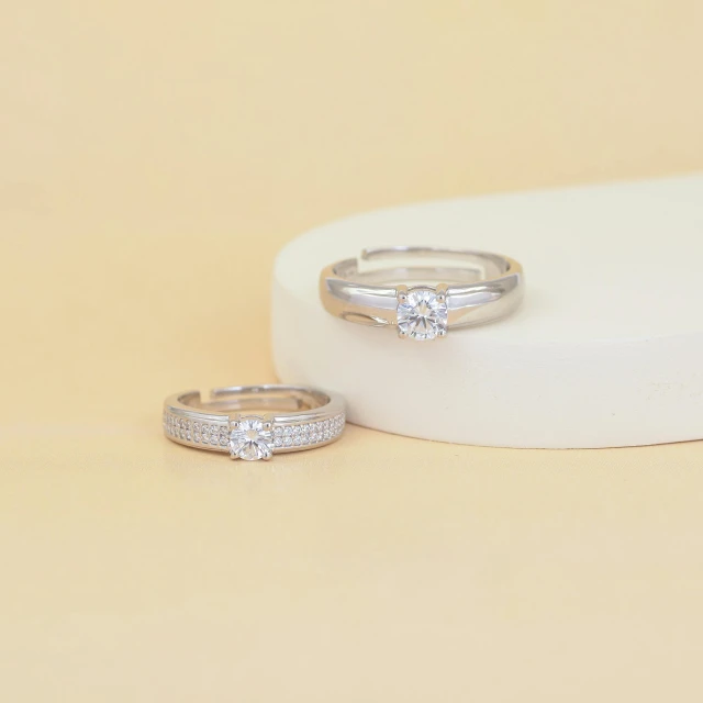 a couple of white gold and diamond rings