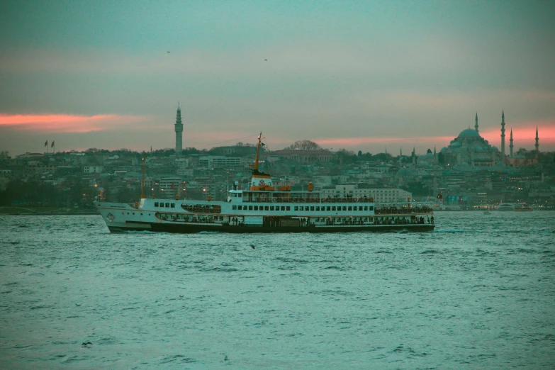 the large boat has two ferry engines attached