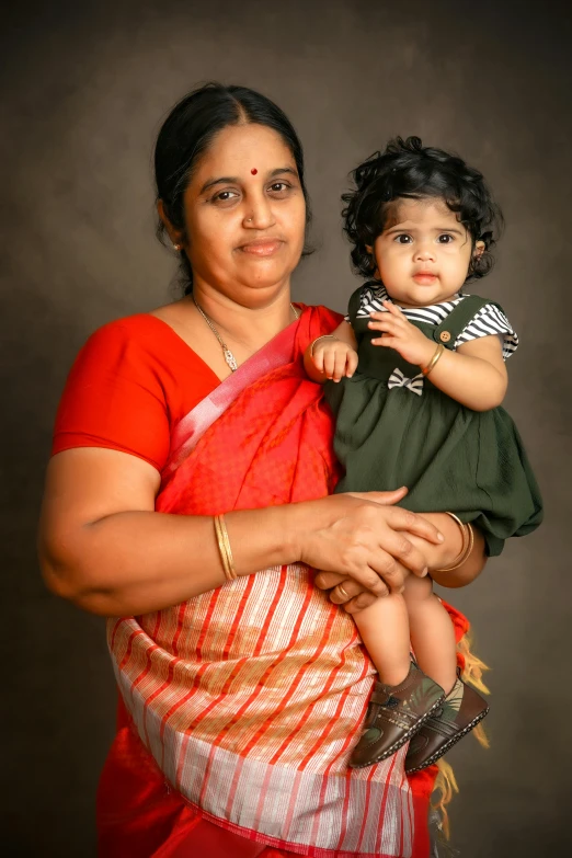 woman holding child in arms in her hands