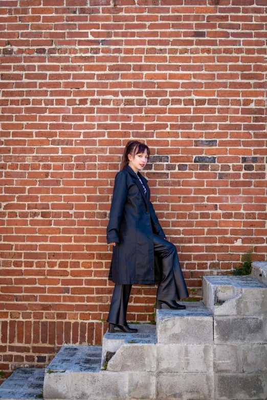 a woman standing at the top of steps