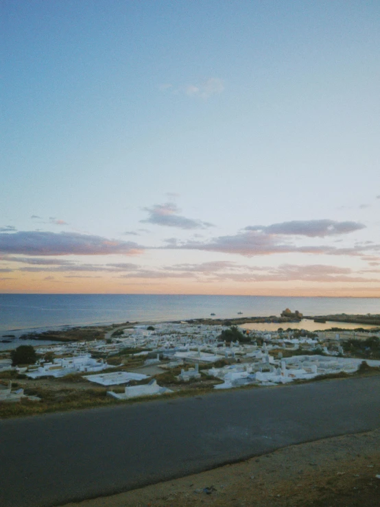 the ocean shore is lined with white houses