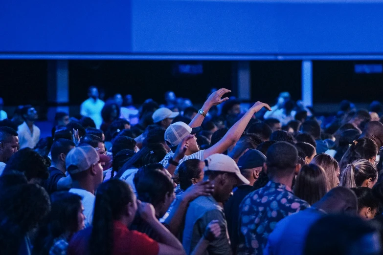 a group of people standing next to each other in a building