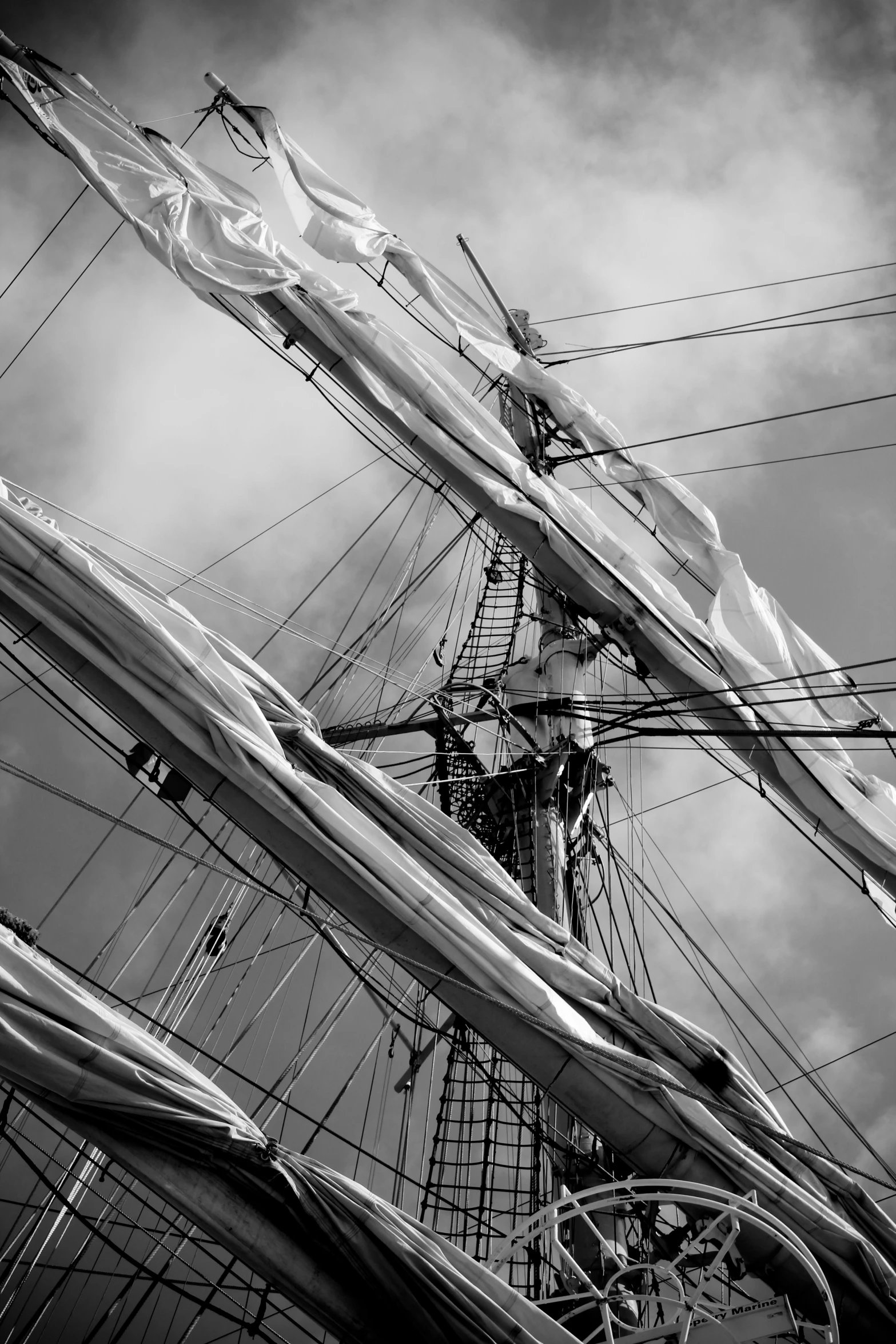 a black and white po of some boats masts