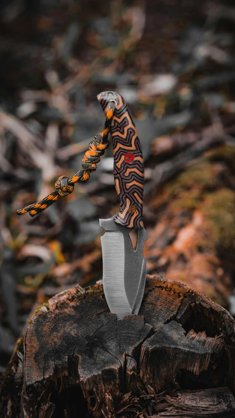 a large, artistic patterned knife with an unusual, sharp blade