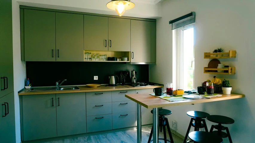 kitchen with counter and stools at sun light