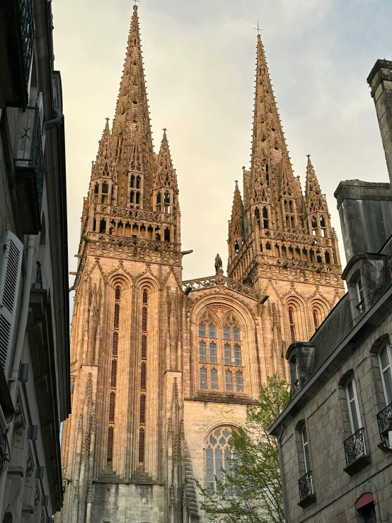 large cathedral standing next to a narrow alley way