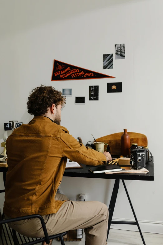 a man sitting at a desk using an office computer