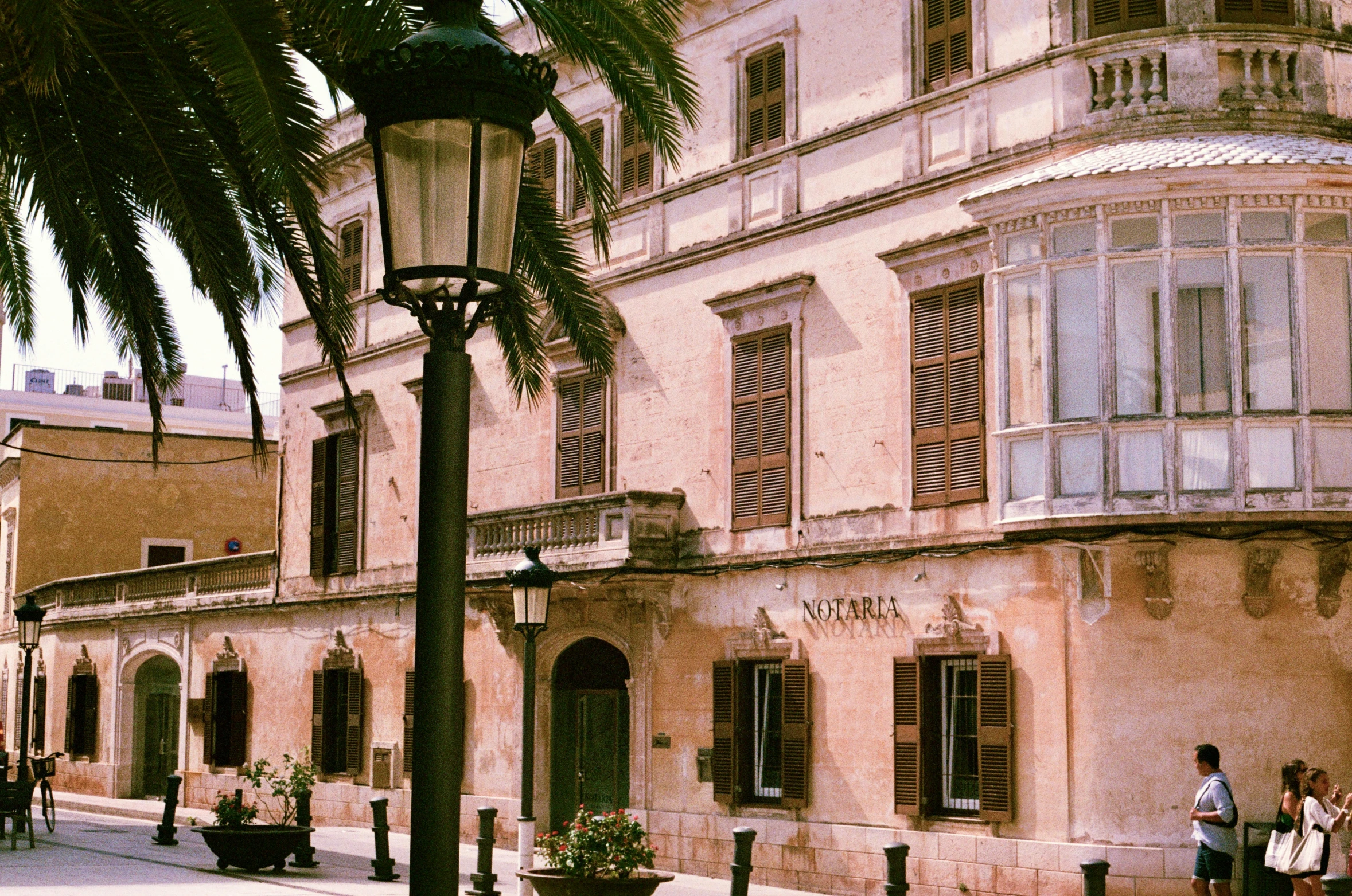 an old building is next to the street