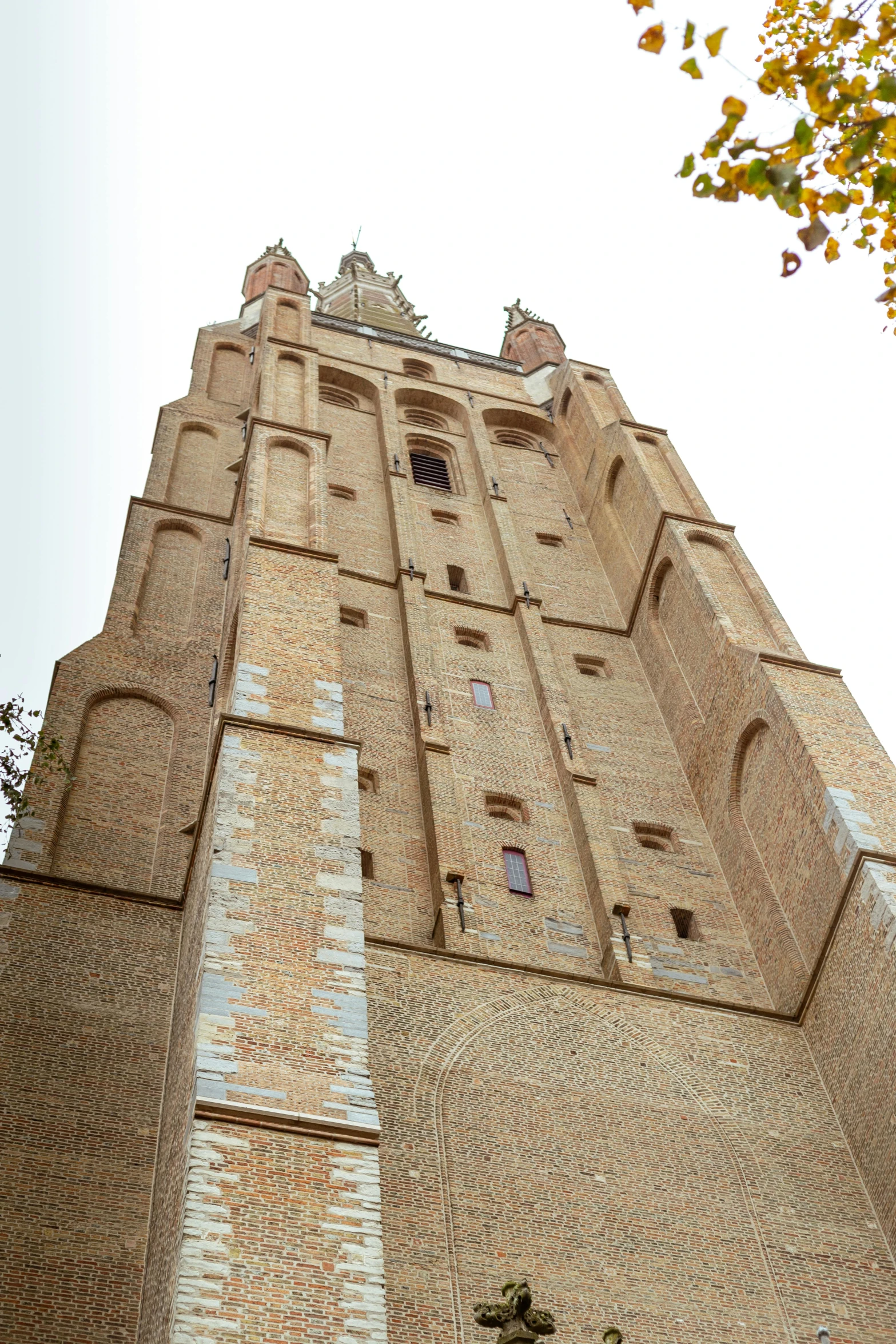 a tall brick tower that has a clock on it