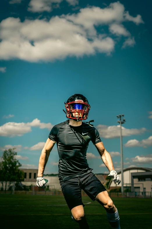 a person in a helmet and shorts playing soccer