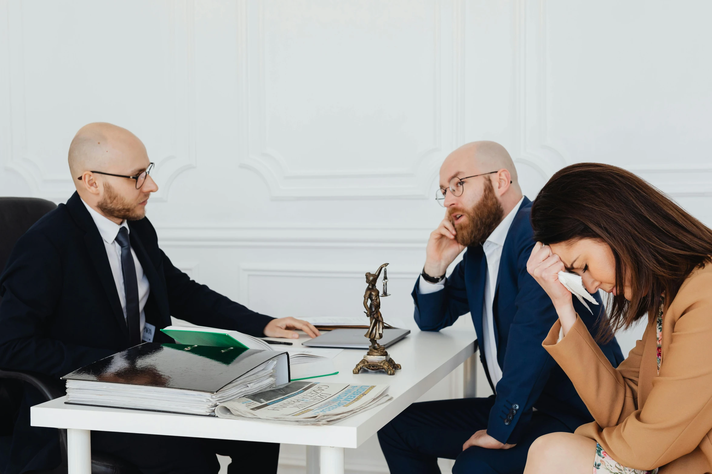 a man is sitting at a table with other people