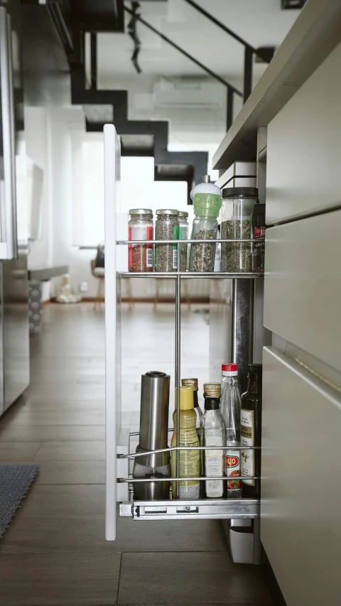 a white shelf with some condiments on it