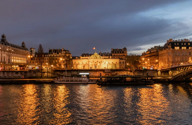 a bridge that is across the water with buildings