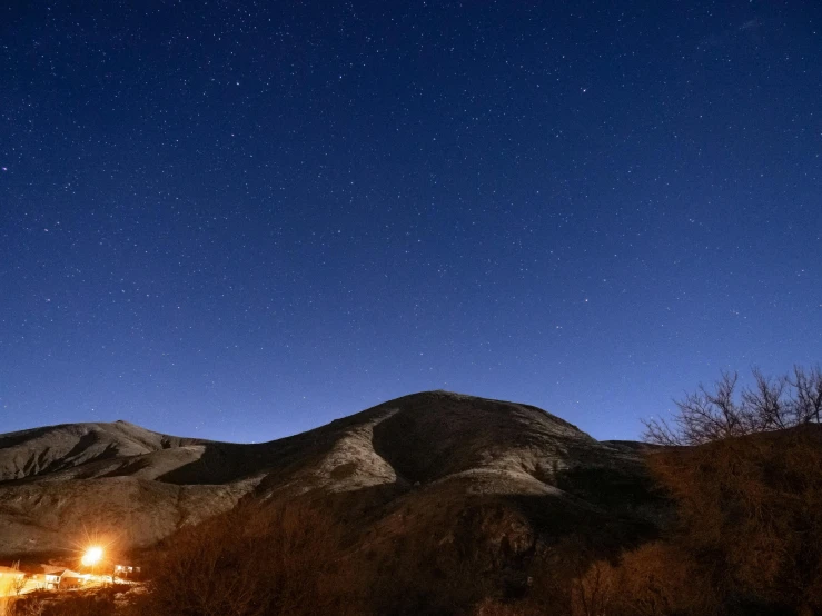 the mountain that surrounds the area is lit up at night