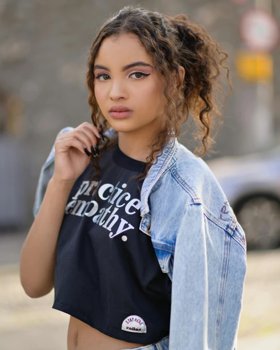 a beautiful woman in short denim shorts and a shirt