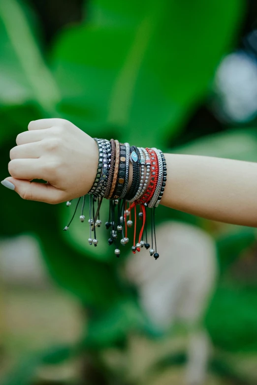 a person with many celets on each wrist