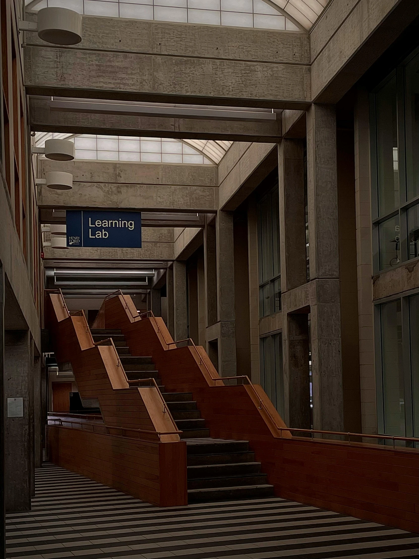 a hallway with some tables and signs in it