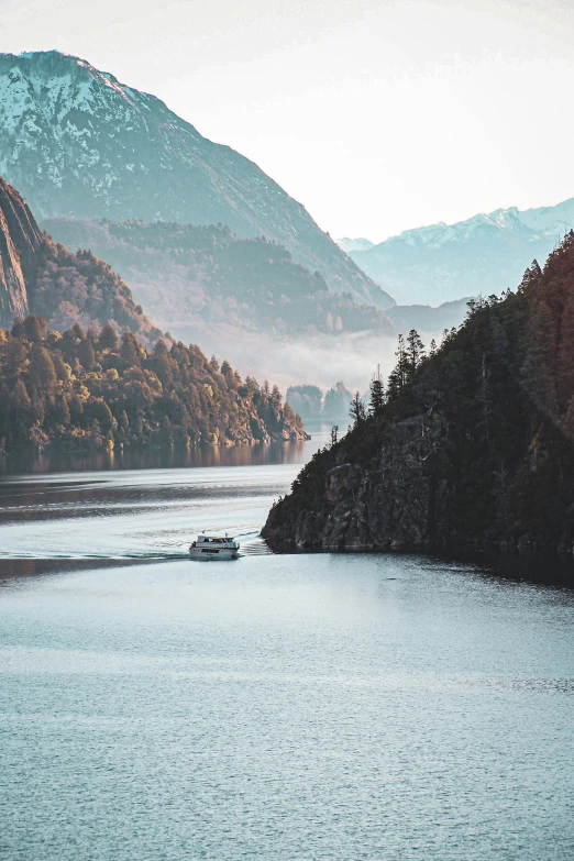 there is a small boat on a large lake