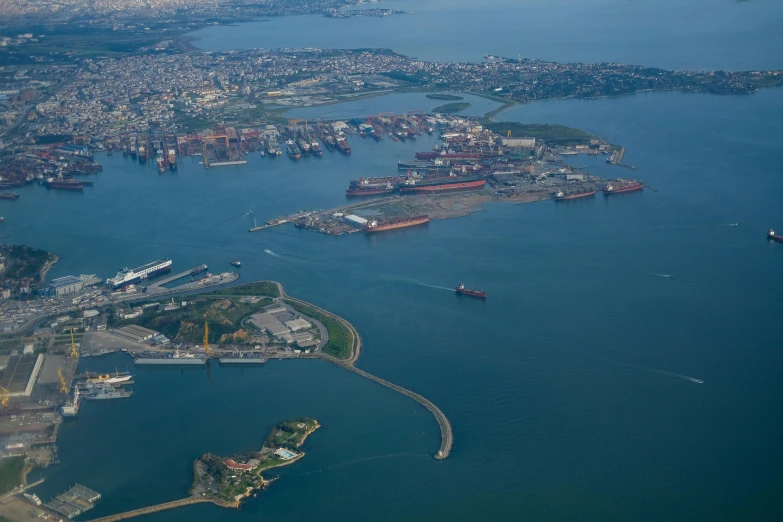 this aerial image shows the coastal city area and large shipping port