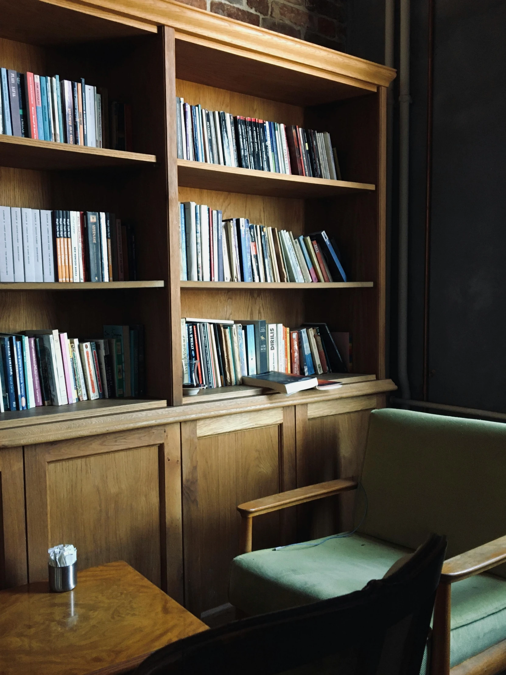 wooden book shelves and chairs in a room