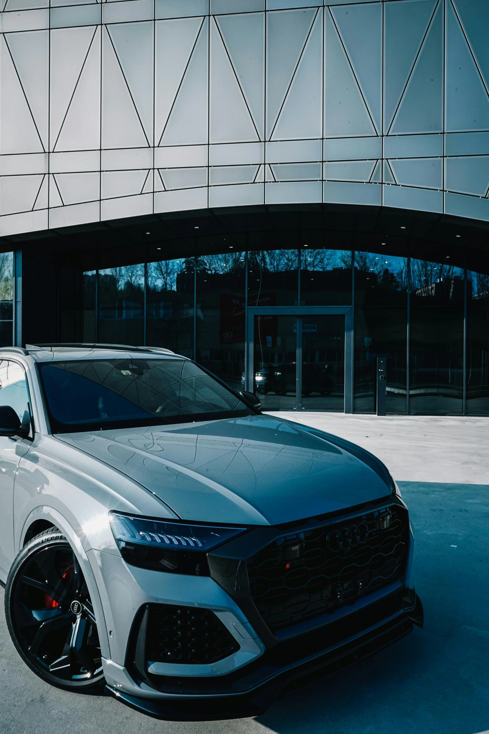 the front end of a silver colored car