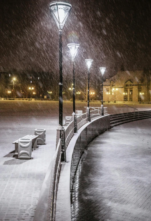 the walkway in the park is covered with snow