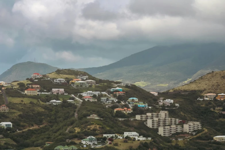 a view of a small town with lots of green houses