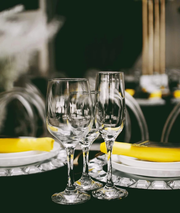 three wine glasses sitting on a table