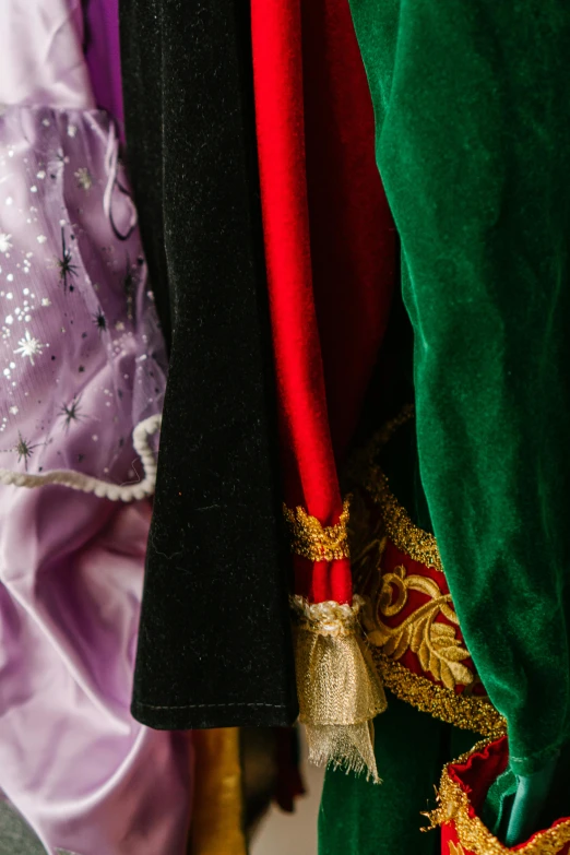 a line of costumes with brightly colored tops