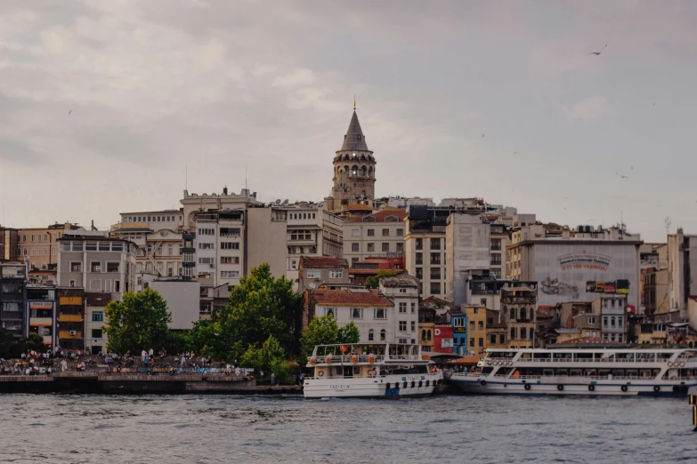 view of river with several boats in it and a large building