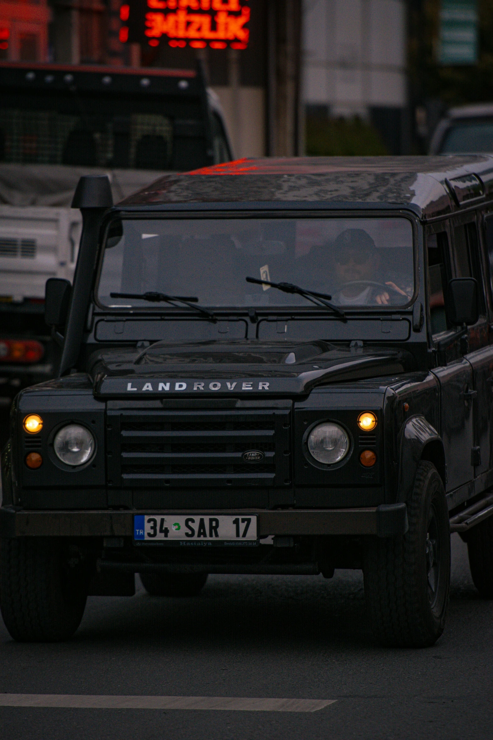 a land rover is sitting in front of the police