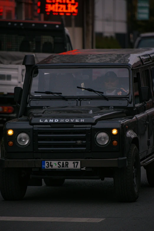 a land rover is sitting in front of the police