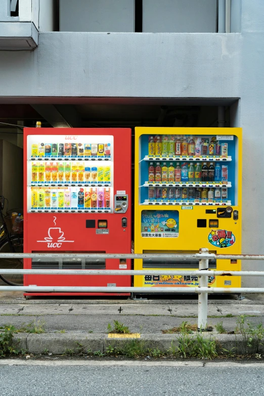 an old vending machine sitting beside a city street