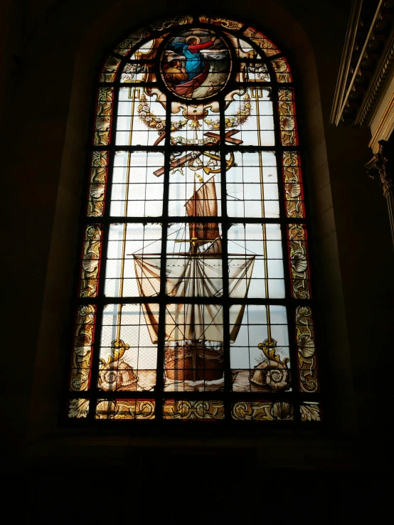 stained glass window at cathedral depicting saint louis in cross