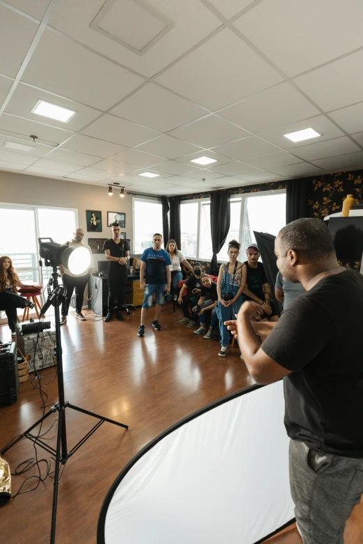 a man is giving a talk to a group of people