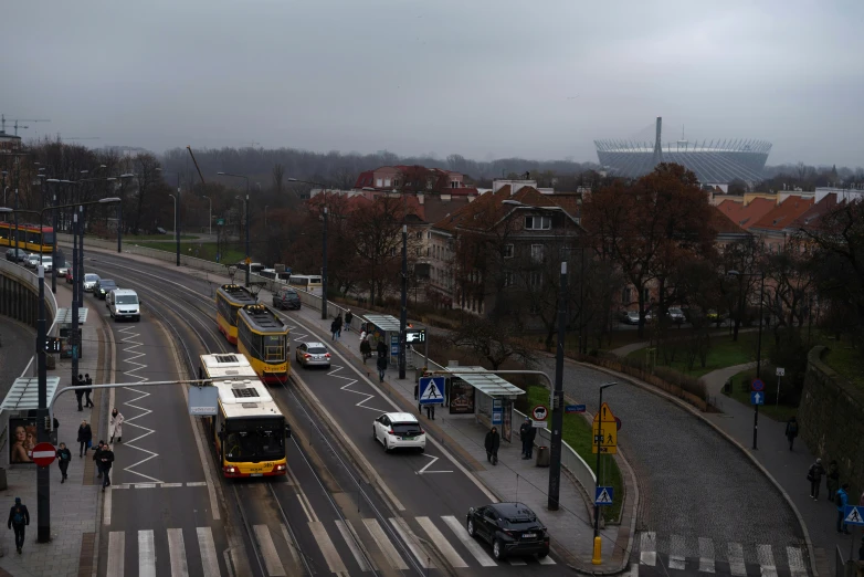 a number of buses on a city street