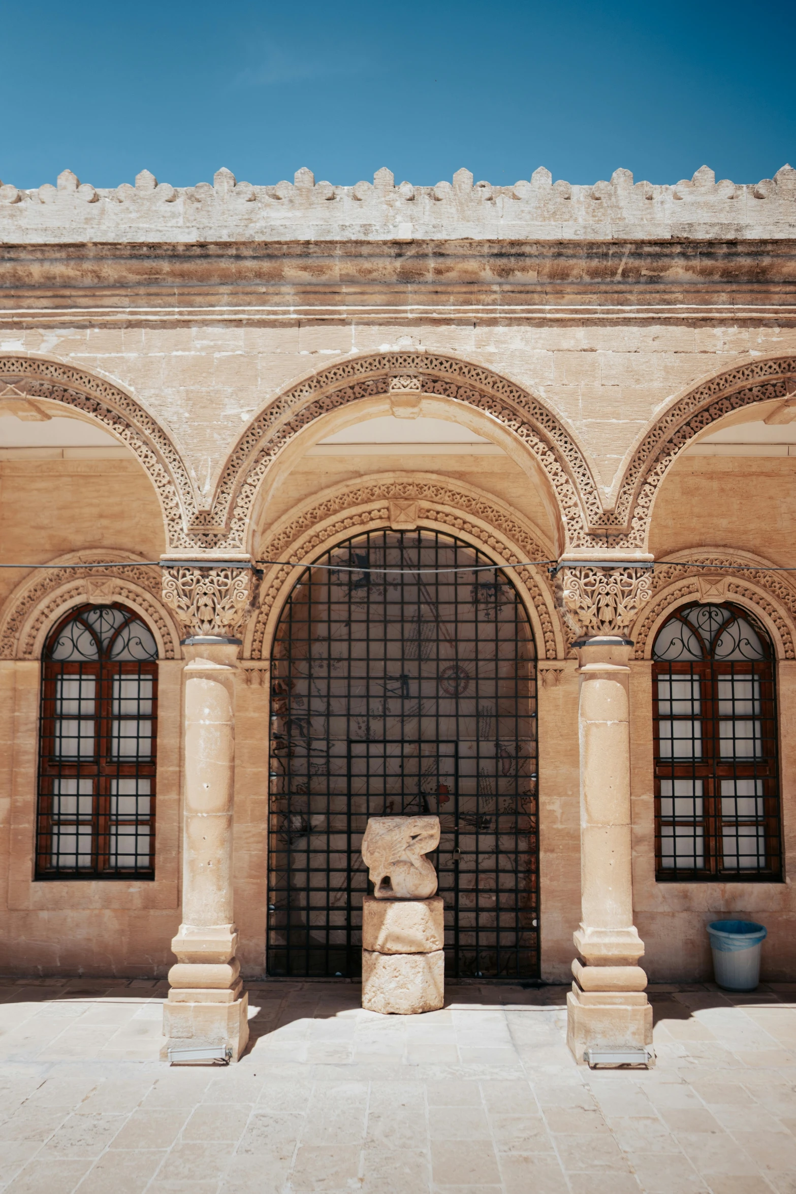 a stone building that has a large window in it