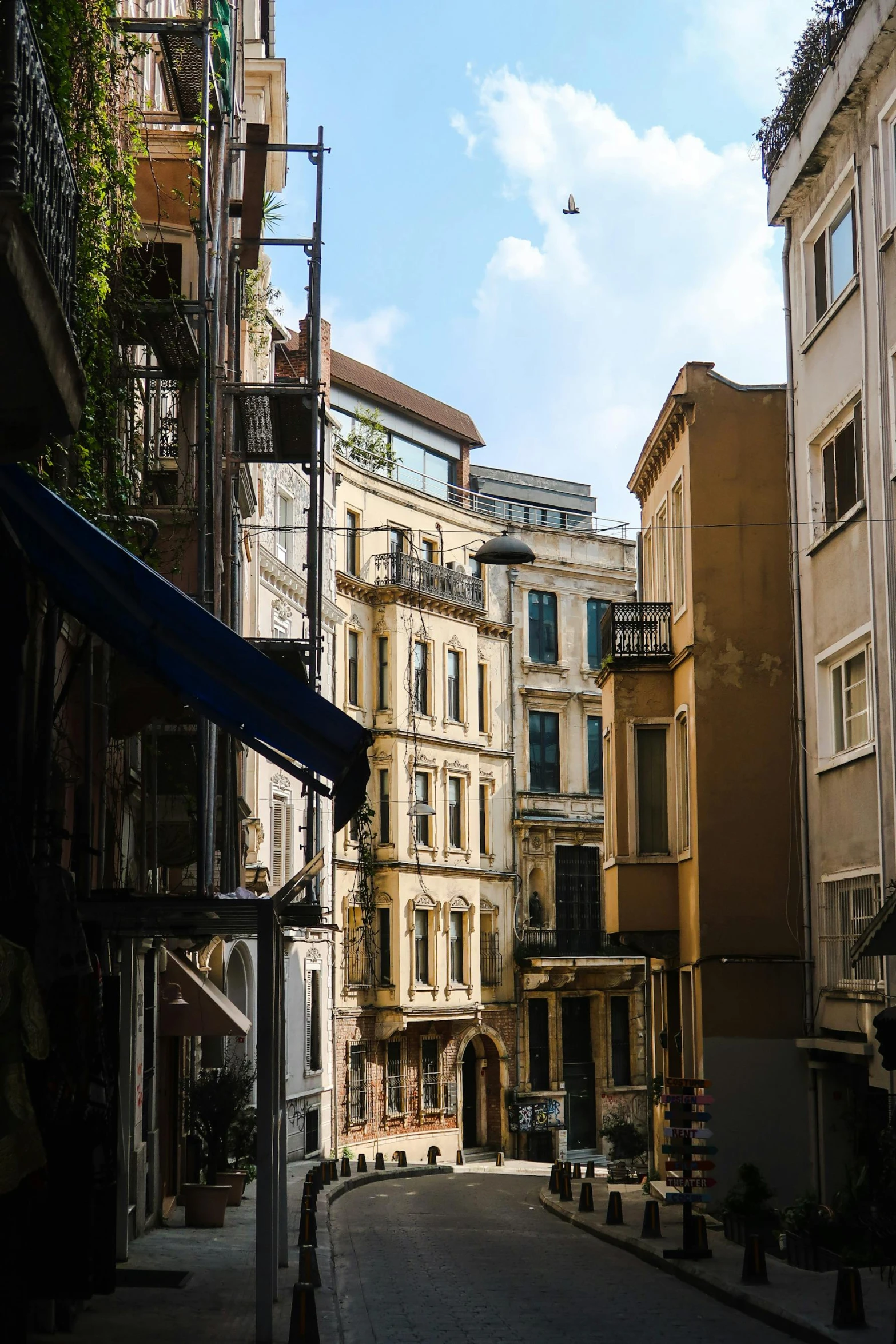 an old city street lined with large building