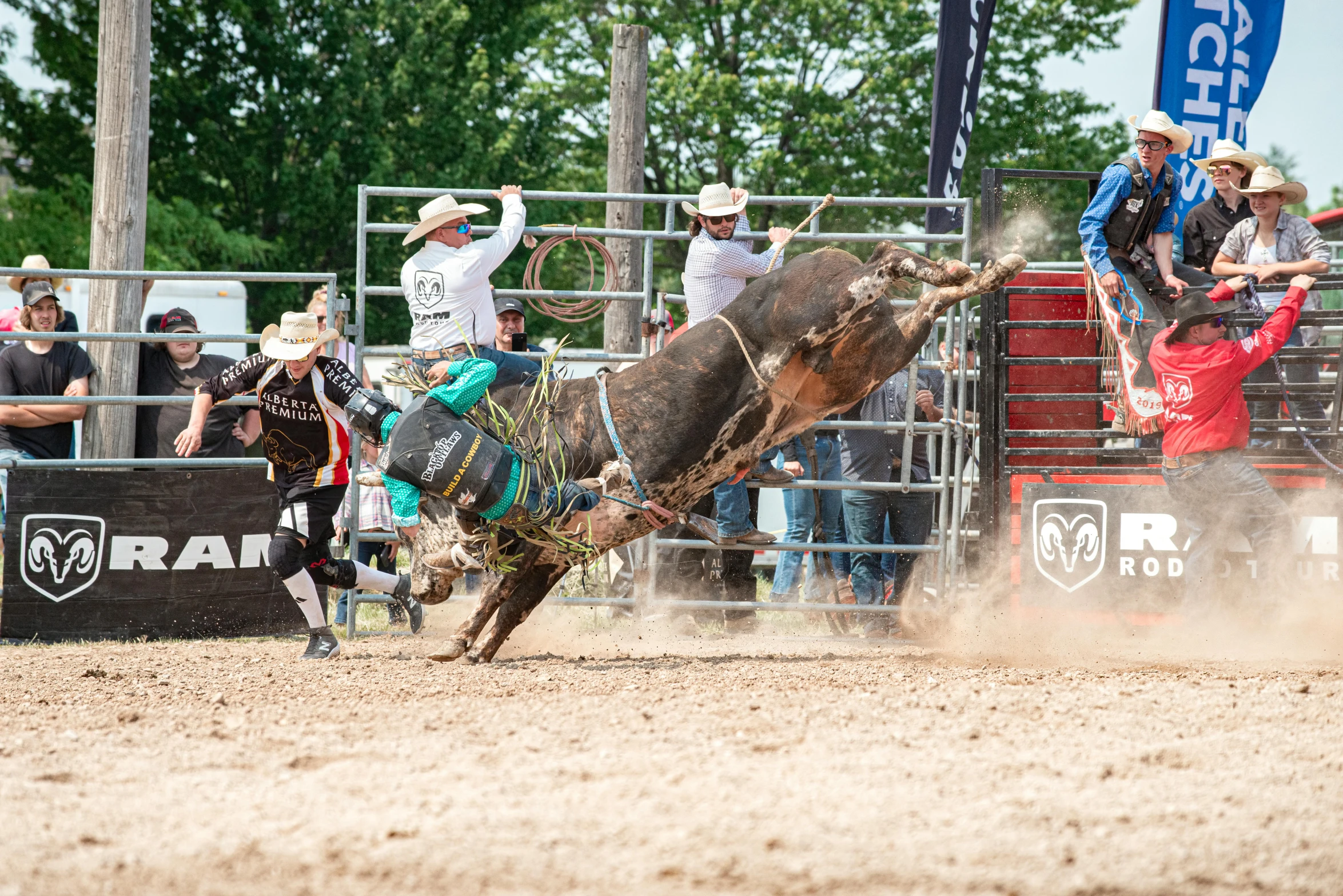 a man riding a bucking horse in a rodeo