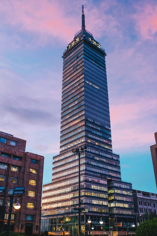 a large tall building that is under the lights