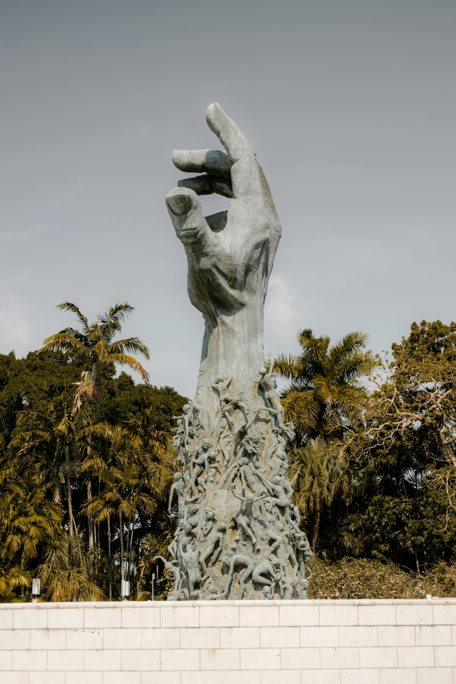 a hand carved to look like a planter reaching towards the sky