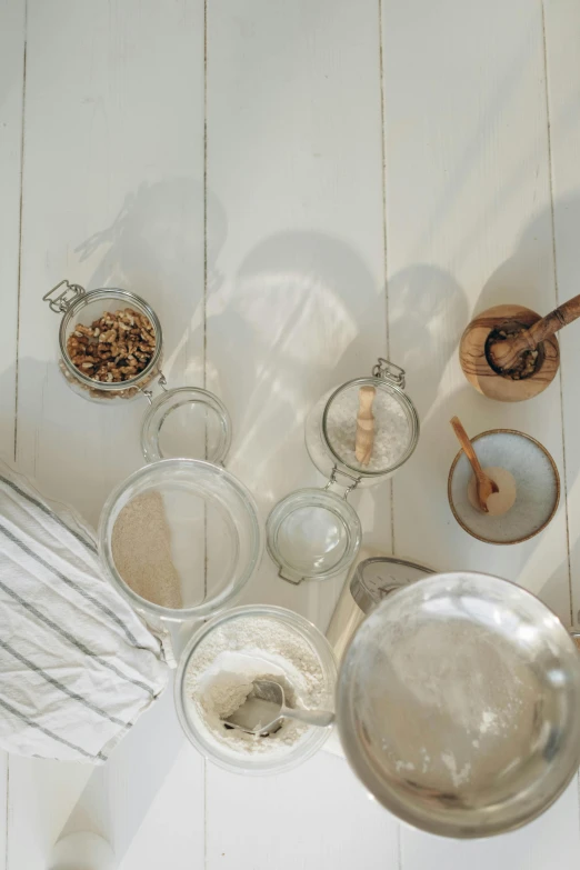 ingredients and utensils sit in bowls and bowls on a table