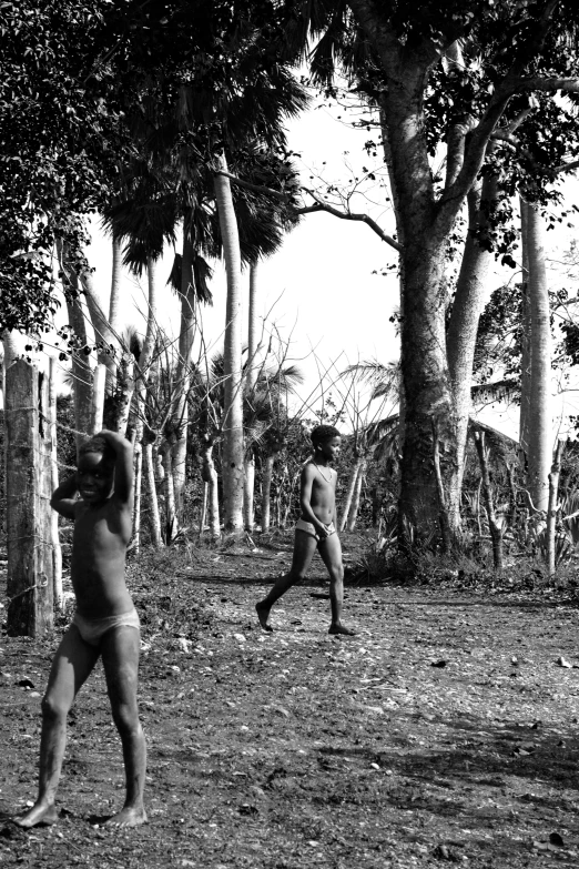 two people stand near one another and play baseball