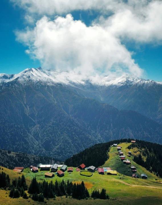 houses sit on the top of a high mountain