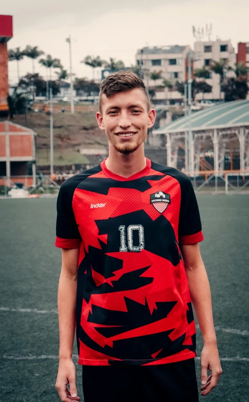 this young man is all smiles on the soccer field