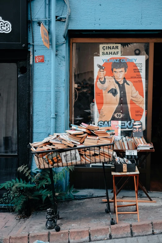 a street with a sidewalk with an antique poster and chair outside