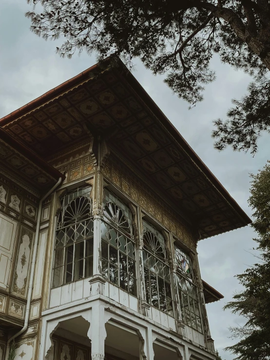 an ornately detailed balcony above a building