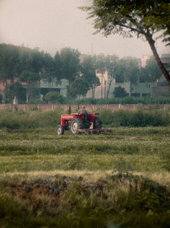 the tractor is preparing to cut the grass